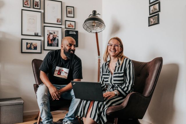 Two eSagu employees sitting at one table.